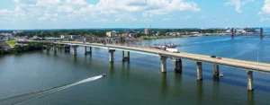 Aerial view of a bridge crossing the Tennessee River in Decatur, Alabama, with boats below.